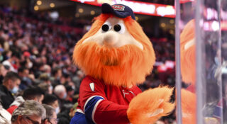 MONTREAL, QC - NOVEMBER 29:  Montreal Canadiens"u2019 mascot Youppi! takes in the atmosphere during the second period in the game against the Vancouver Canucks at Centre Bell on November 29, 2021 in Montreal, Canada.  The Vancouver Canucks defeated the Montreal Canadiens 2-1.  (Photo by Minas Panagiotakis/Getty Images)